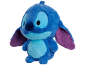 Peluche bleue d'un personnage extraterrestre avec de grands yeux et des oreilles violettes.