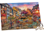 Un puzzle coloré représentant une ville pittoresque au bord de l'eau au coucher du soleil.
