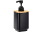 Distributeur de savon noir mat avec pompe et couvercle en bambou.