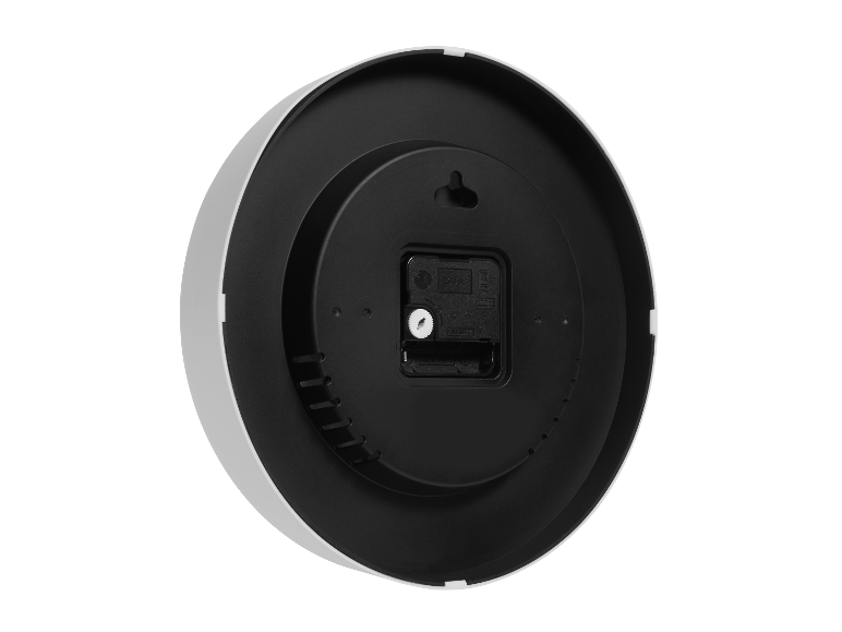 Vue arrière d'une horloge murale ronde blanche et noire.