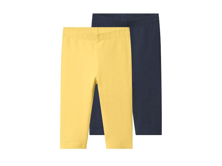 Deux paires de leggings pour enfants, un jaune et un bleu foncé.