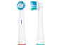 Deux têtes de brosse à dents électriques avec des poils bleus et verts.