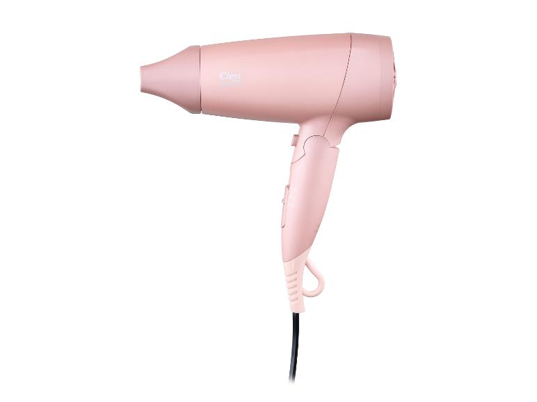 Sèche-cheveux rose avec réglages de chaleur et de vitesse
