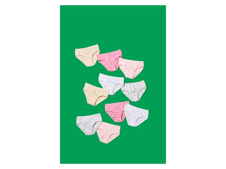 Assortiment de culottes en coton colorées pour enfants sur fond vert