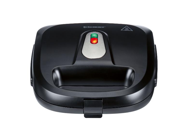 Gaufrier noir avec voyants lumineux et poignée, vue de dessus.