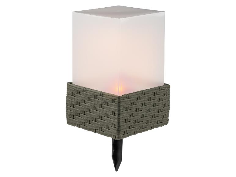 Lampe solaire de jardin avec design tressé et effet flamme.