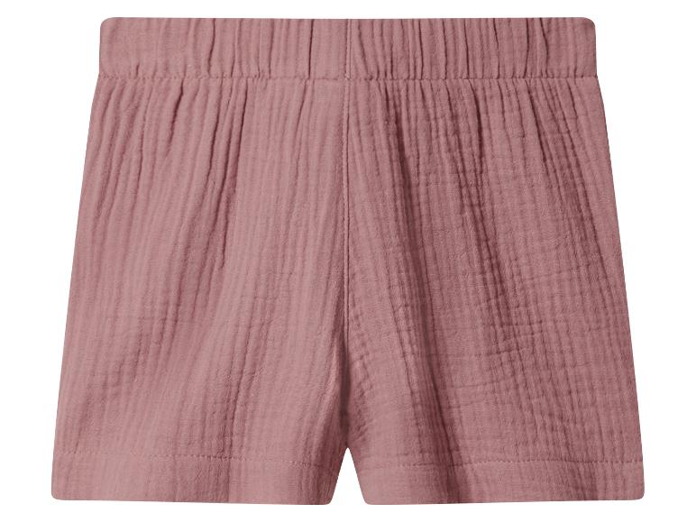 Shorts roses avec taille élastique et texture froissée.