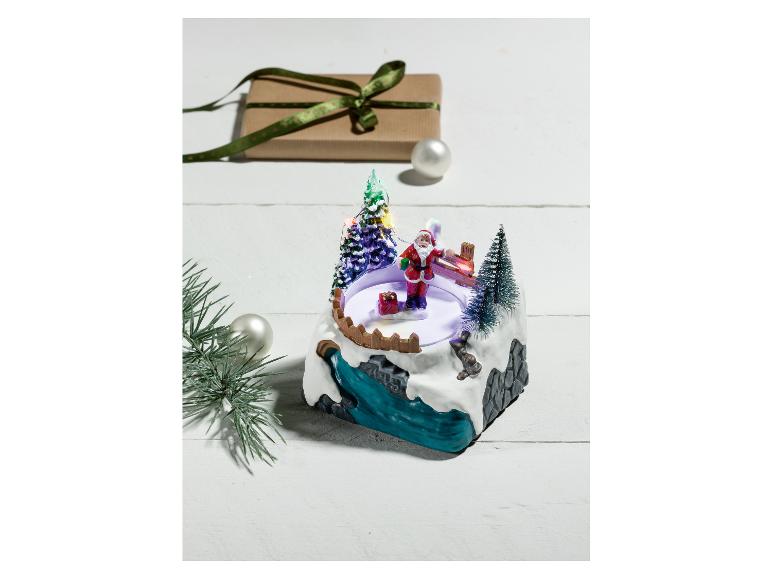 Un carillon de Noël avec le Père Noël et un sapin de Noël