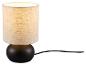 Lampe de table avec base sphérique noire et abat-jour cylindrique en tissu beige, allumée.