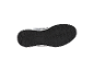 Semelle de chaussure de sport noire avec motif de bande de roulement robuste.