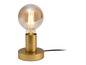 Lampe de table dorée avec un abat-jour rond en verre.