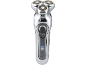 Rasoir électrique rechargeable avec trois têtes rotatives et indicateur de charge.