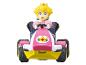 Un kart rose avec une figurine de la princesse Peach de Mario Kart.