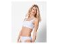 Femme en lingerie blanche Sloggi.