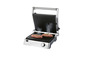 Un grill électrique avec deux steaks grillés.