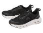 Chaussures de sport pour homme CRIVIT en noir avec semelle blanche.