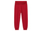 Pantalon de survêtement rouge avec ceinture élastique.