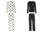 Deux ensembles de pyjamas: un avec des pois noirs et un avec des cœurs blancs.