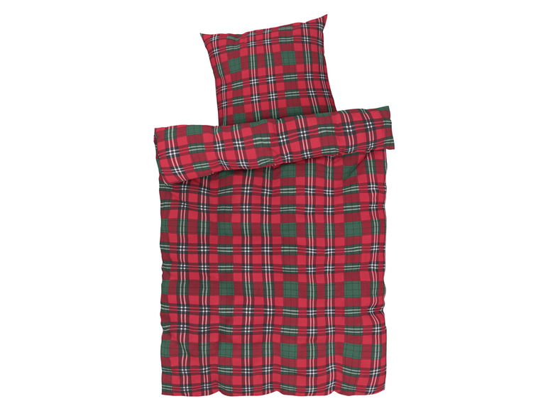 Une parure de lit à carreaux rouges et verts.