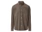 Chemise en velours côtelé marron avec boutons et poche poitrine.