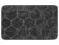 Un tapis de bain gris avec un motif en nid d'abeille.
