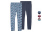 Deux leggings pour filles, un avec un motif de couronnes et un uni bleu foncé.