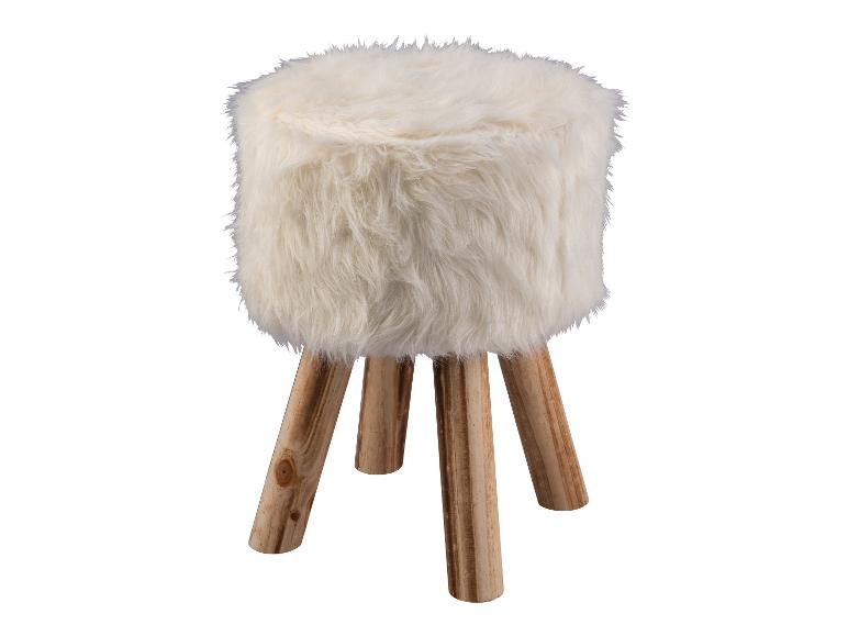 Un pouf en fourrure blanche sur des pieds en bois