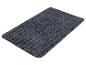 Un tapis de bain gris foncé avec des nervures.