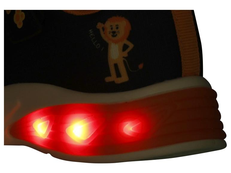 Chaussure pour enfant avec semelle lumineuse et personnage de lion de dessin animé disant 'HELLO!'