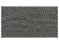 Un tapis gris foncé avec un motif géométrique blanc.