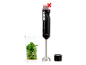Mixeur plongeant sans fil SILVERCREST® avec verre doseur rempli de basilic et d'ail.