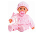 Une poupée bébé rose avec une sucette et un biberon.