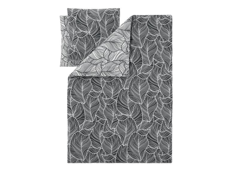 Parure de lit gris foncé avec motif feuilles blanches, incluant deux taies d'oreiller.