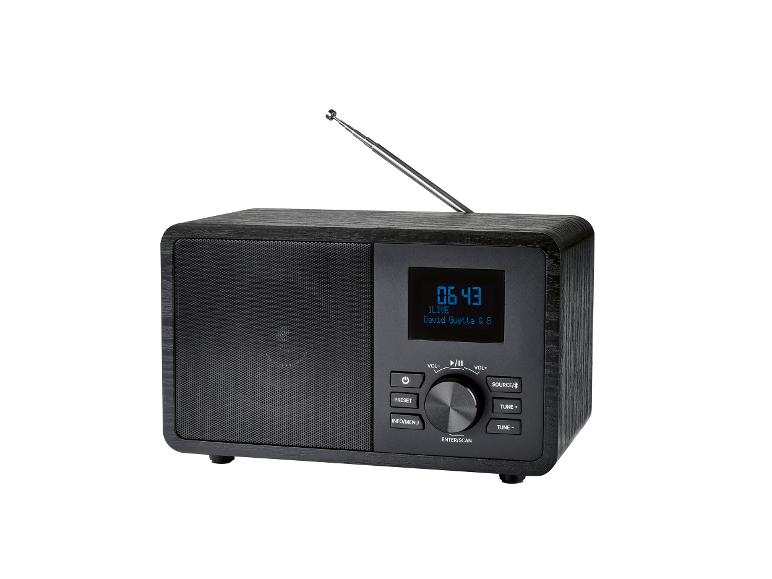 Radio numérique en bois noir avec écran, boutons et antenne télescopique.