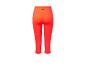 Leggings courts orange vif pour sport.