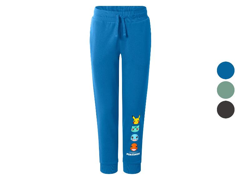Pantalon de survêtement bleu avec imprimés de personnages de dessins animés et texte.