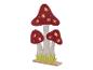 Lampes champignons en feutre avec feuilles découpées.