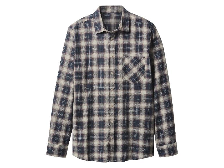 Chemise à carreaux à manches longues dans les tons bleu, beige et marron.