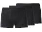 Trois boxers noirs pour hommes, empilés les uns derrière les autres.