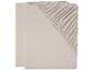 Deux draps-housses beige.