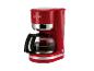 Cafetière rouge avec verseuse en verre et accents argentés, avec le texte « 1973 »