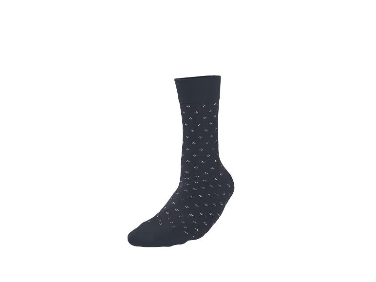 Chaussette gris foncé avec un petit motif blanc.