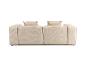 Canapé modulaire beige avec coussins, vue arrière