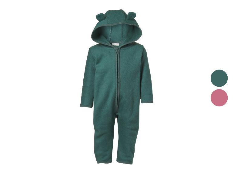 Combinaison polaire vert foncé avec capuche et oreilles, fermeture éclair frontale.