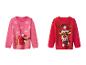 Deux pulls de Noël pour enfants : un rose avec un teckel et un rouge avec un renne.