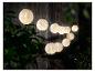 Guirlande lumineuse extérieure avec lanternes blanches.