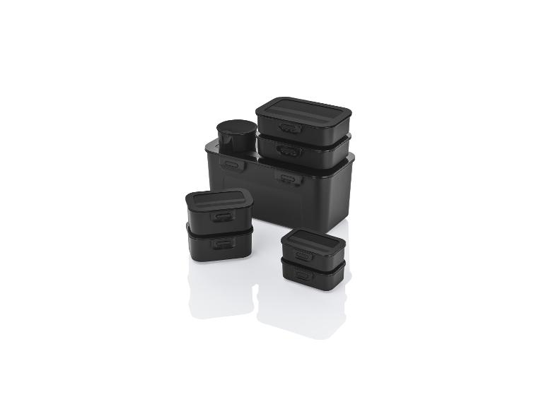 Un ensemble de boîtes de rangement noires avec couvercles.