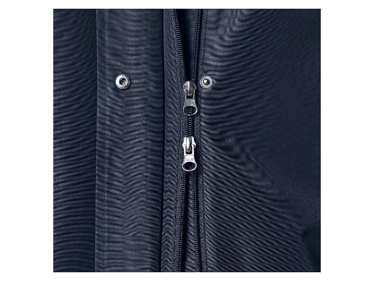 Gros plan d'une veste bleu foncé avec une fermeture éclair et des boutons-pression