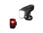 Un phare avant de vélo noir et un feu arrière rouge.