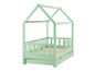 Un lit enfant en bois vert clair avec un dais et deux tiroirs.